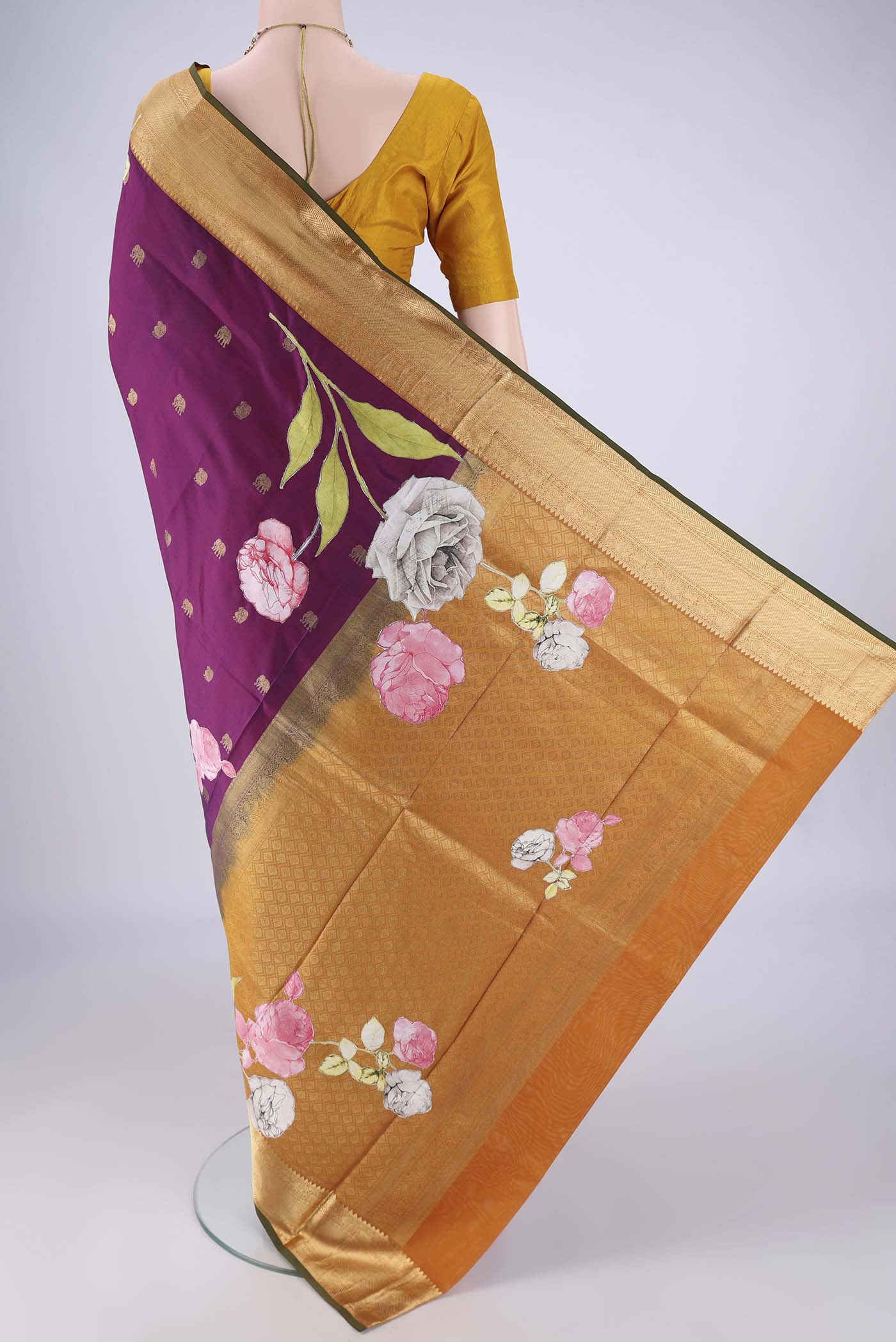 Flat view of Purple Kanjivaram Silk Saree with Zari Butta on the body and Zari Border. 