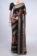 Pure Silk Black Printed Saree with Printed design on the body and Zari Border.  displayed on a mannequin