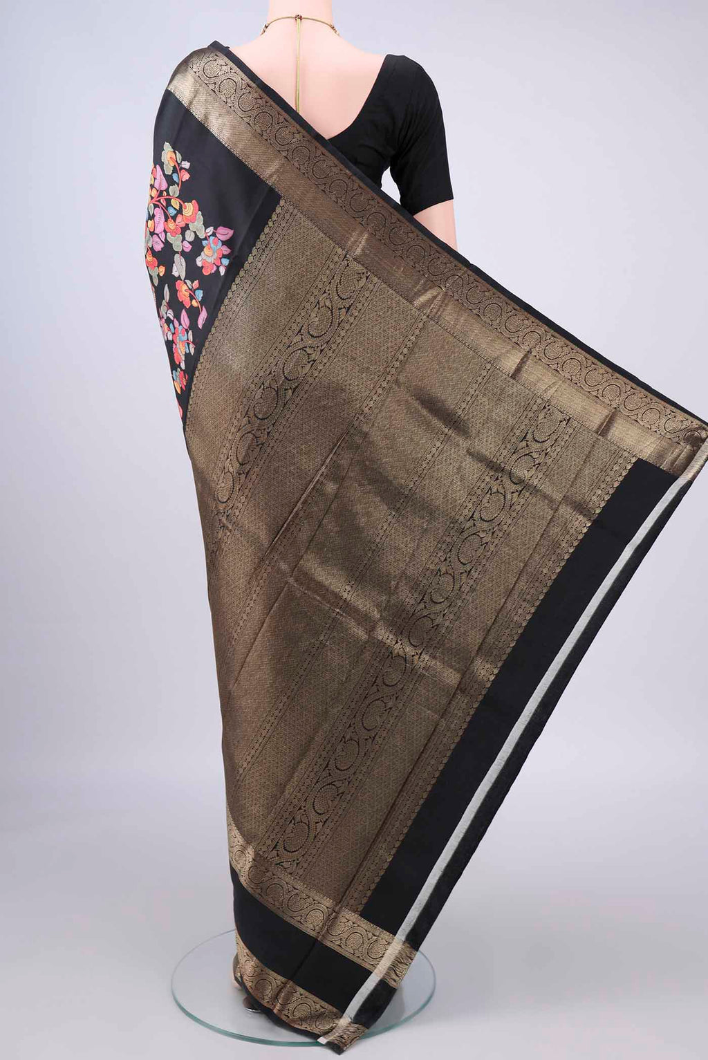 Flat view of Pure Silk Black Printed Saree with Printed design on the body and Zari Border. 