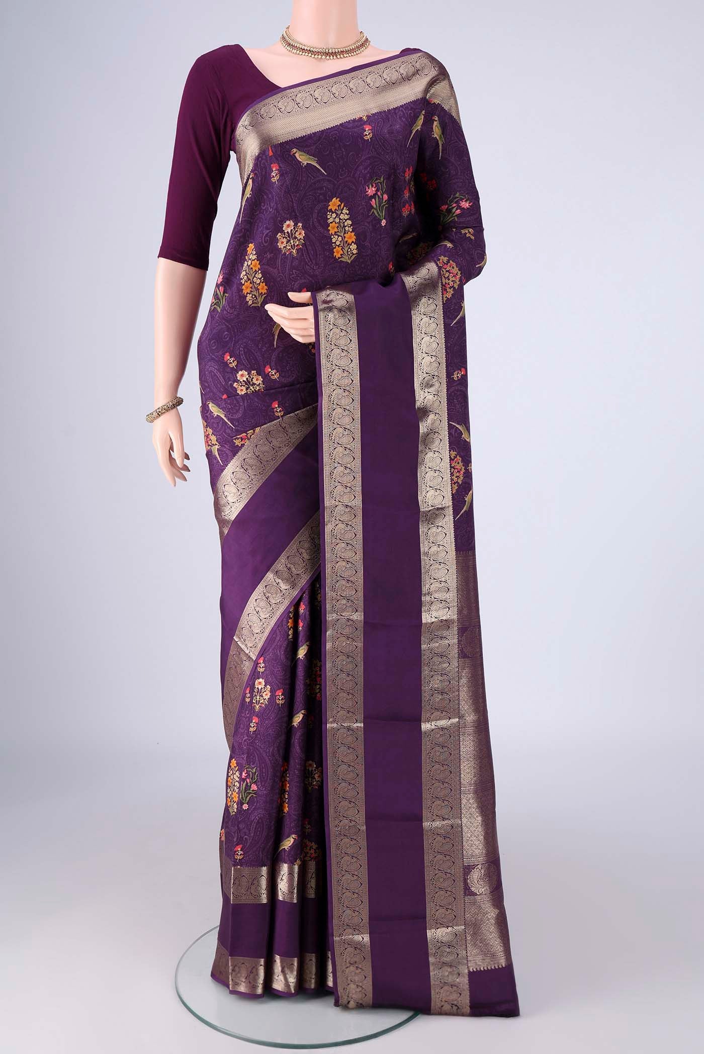 Violet Printed Silk Saree with Bird Print on the body and Zari Border.  displayed on a mannequin