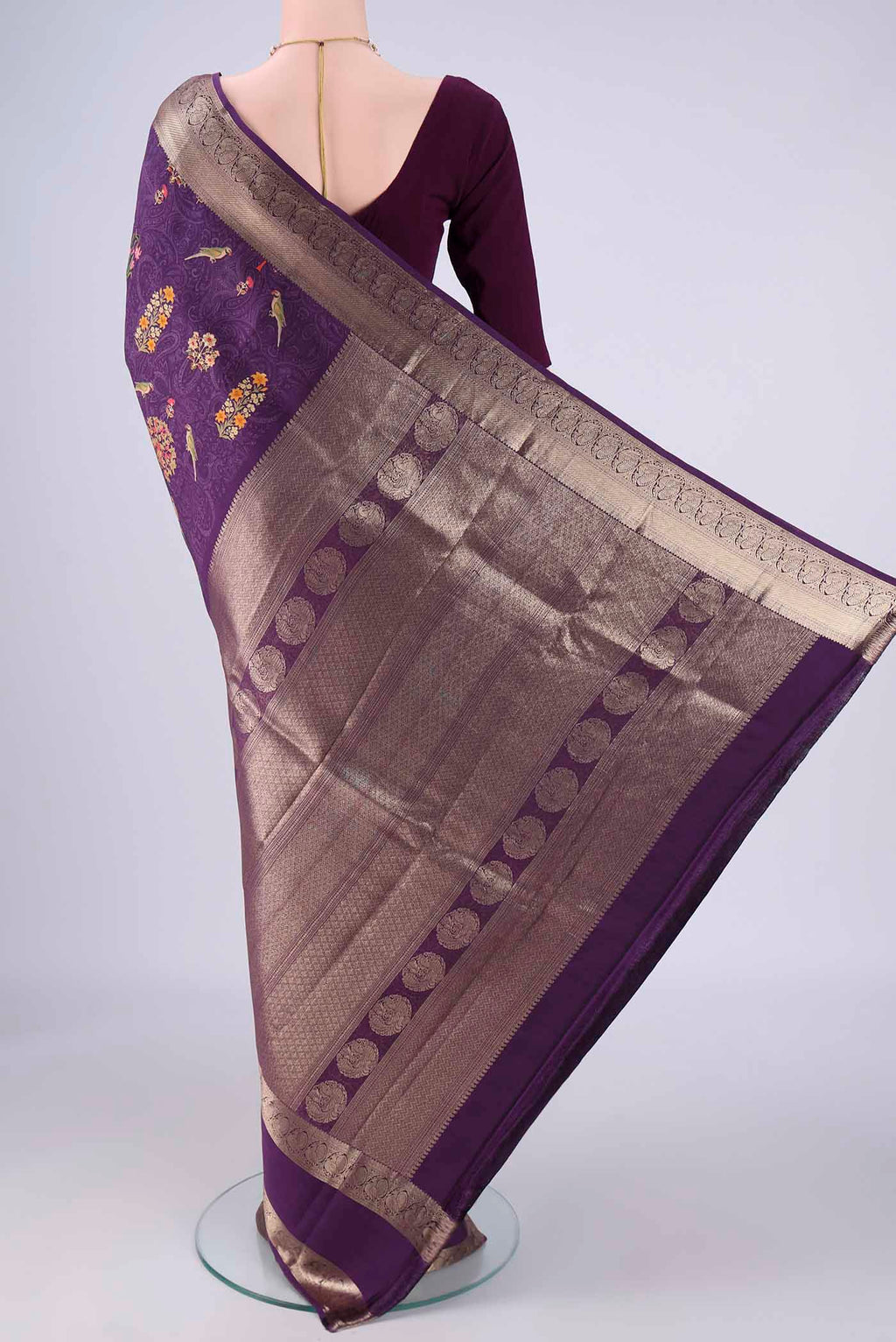 Flat view of Violet Printed Silk Saree with Bird Print on the body and Zari Border. 