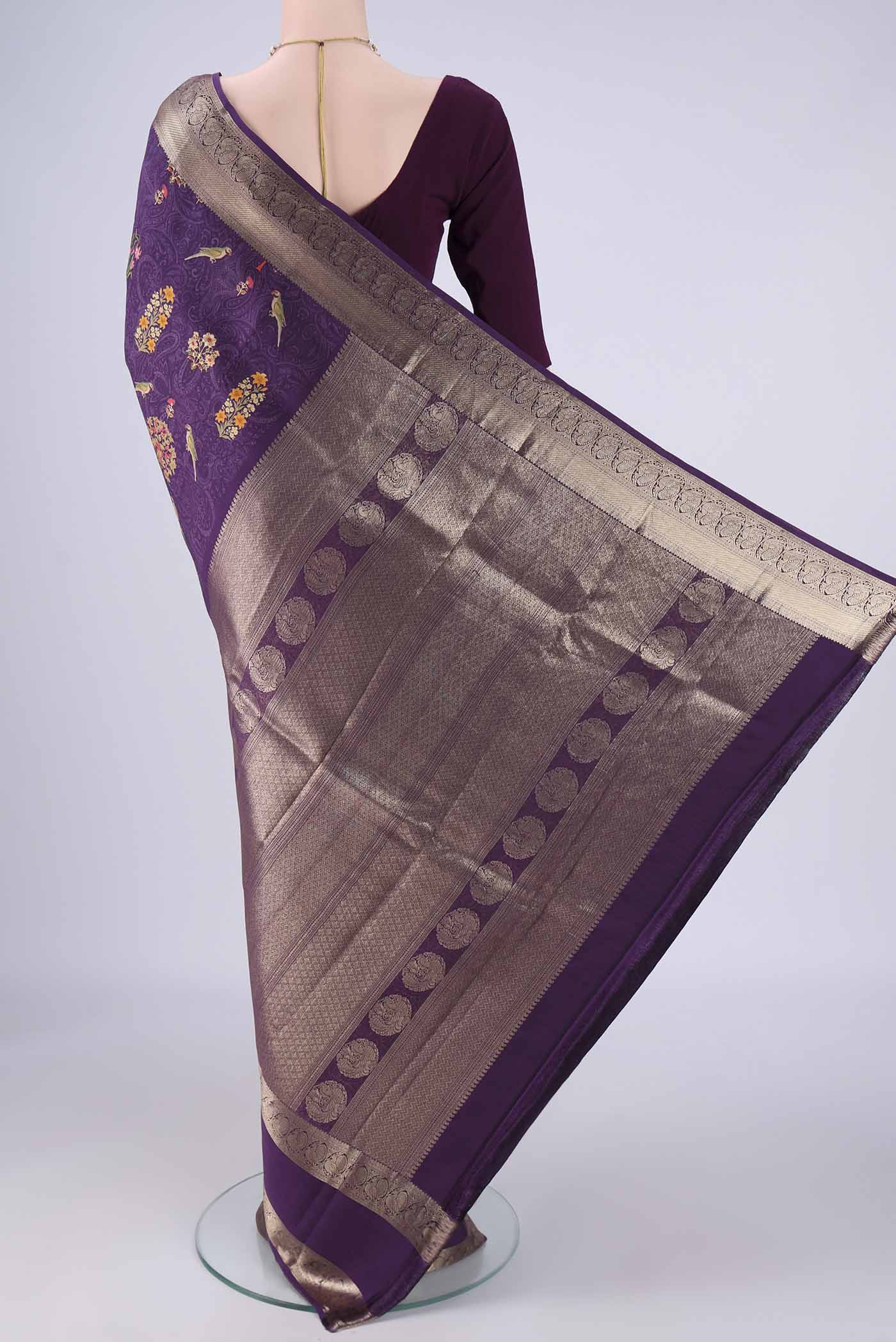 Flat view of Violet Printed Silk Saree with Bird Print on the body and Zari Border. 