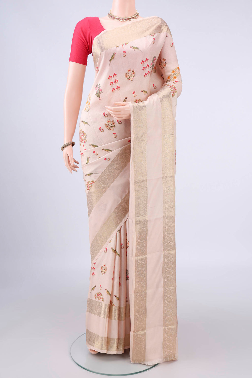 Pure Silk Beige Printed Saree with Printed design on the body and Zari Border.  displayed on a mannequin