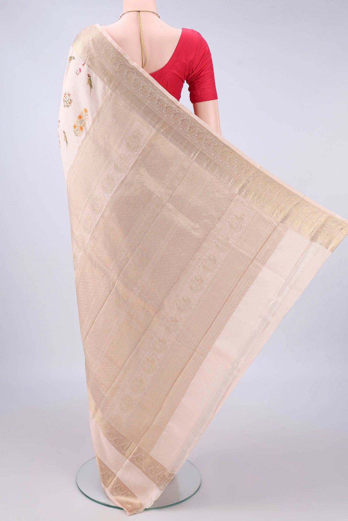 Flat view of Pure Silk Beige Printed Saree with Printed design on the body and Zari Border. 