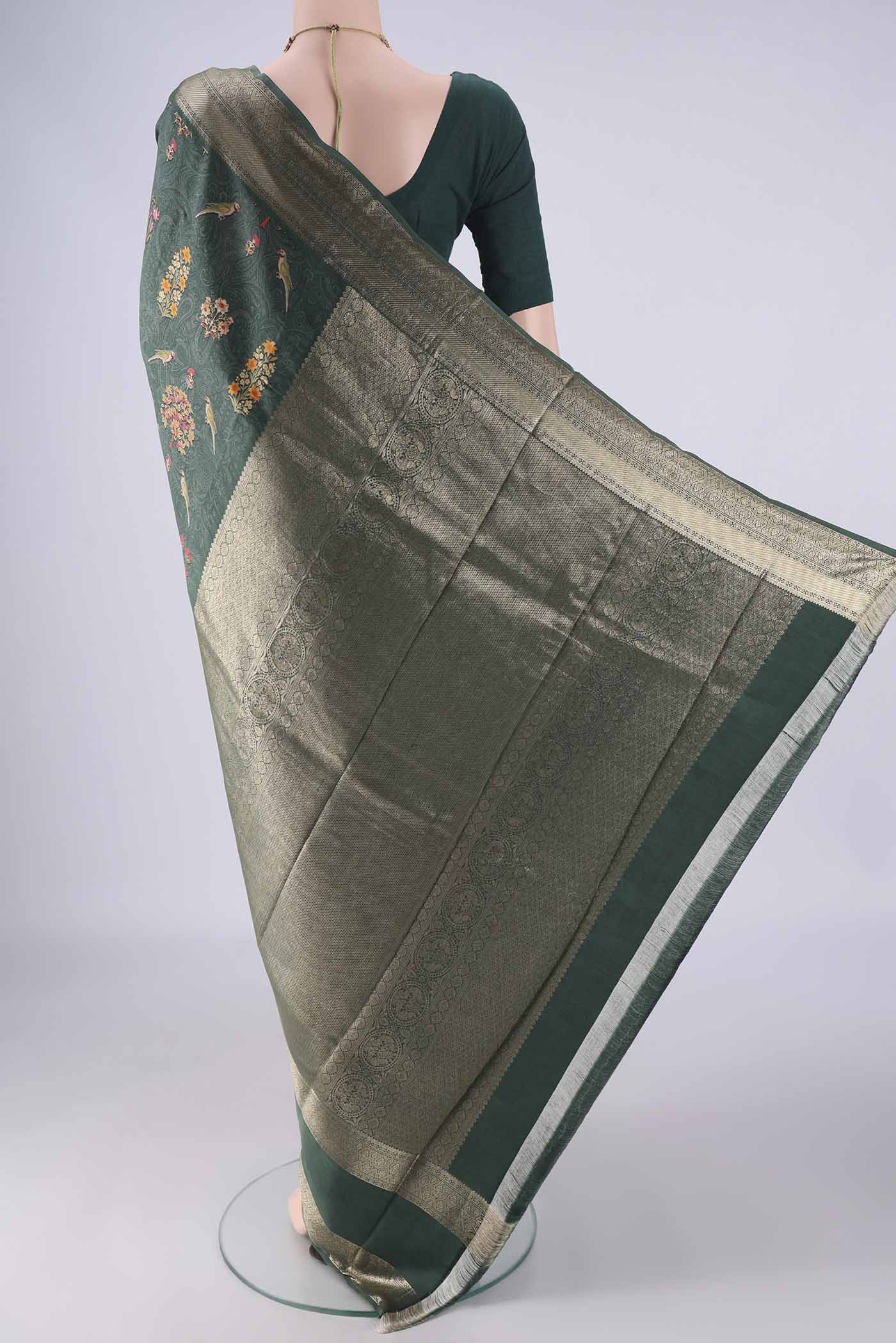 Flat view of Olive Green Kanchipuram Silk Saree with Floral Print on the body and Zari Border. 