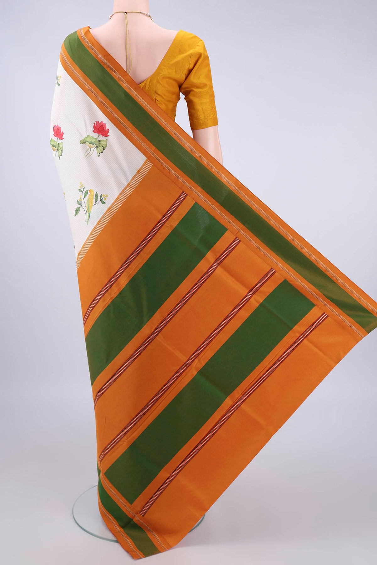 Flat view of Pure Silk Cream Printed Saree with Printed design on the body and Thread Border. 