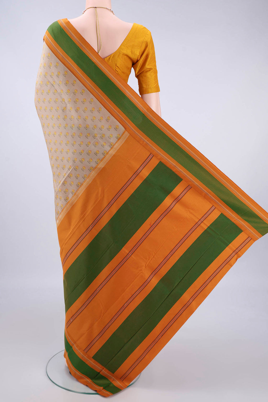 Flat view of Pure Silk Beige Printed Saree with Printed design on the body and Thread Border. 