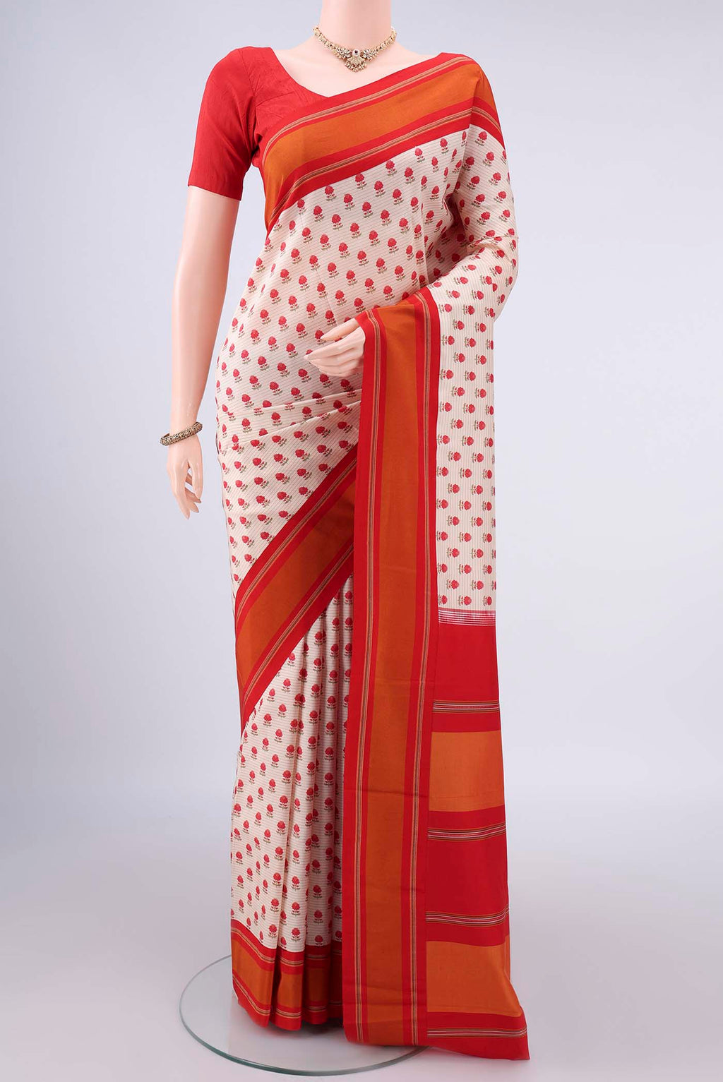 Pure Silk Off White Printed Saree with Printed design on the body and Thread Border.  displayed on a mannequin