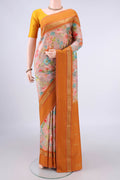 Pure Silk Beige Printed Saree with Floral Print on the body and Zari Border.  displayed on a mannequin