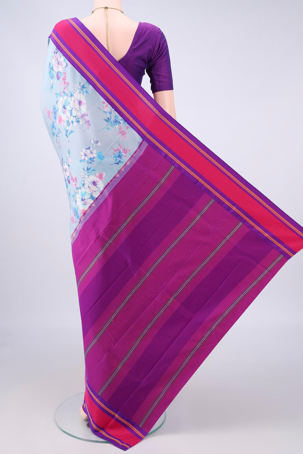 Flat view of Pure Silk Sky Blue Printed Saree with Floral Print on the body and Plain Border. 