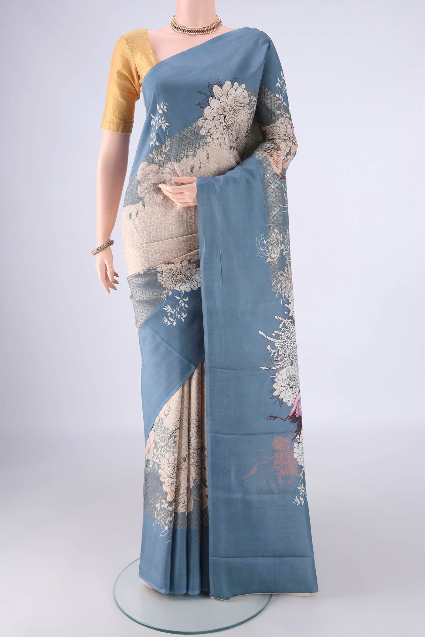 Off White Banarasi Silk Saree with Zari Brocade on the body and Plain Border.  displayed on a mannequin