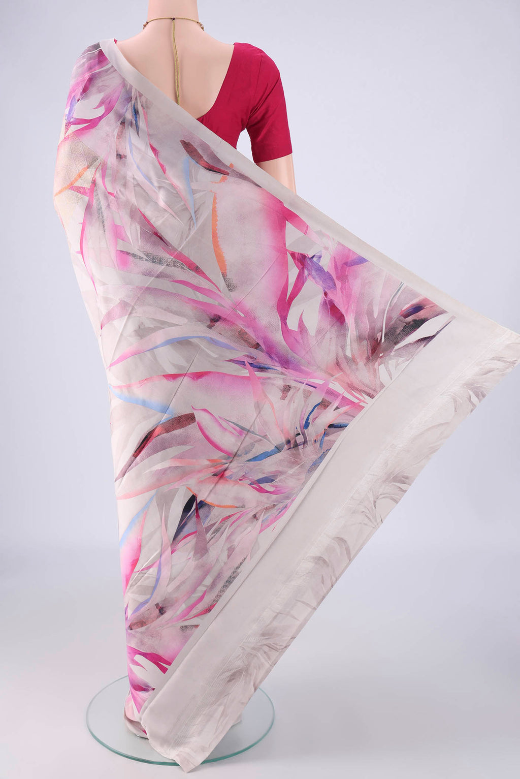 Flat view of Grey Printed Silk Saree with Floral Print on the body and Zari Border. 