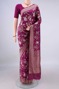 Pure Silk Magenta Banarasi Saree with Zari Butta on the body and Zari Border.  displayed on a mannequin
