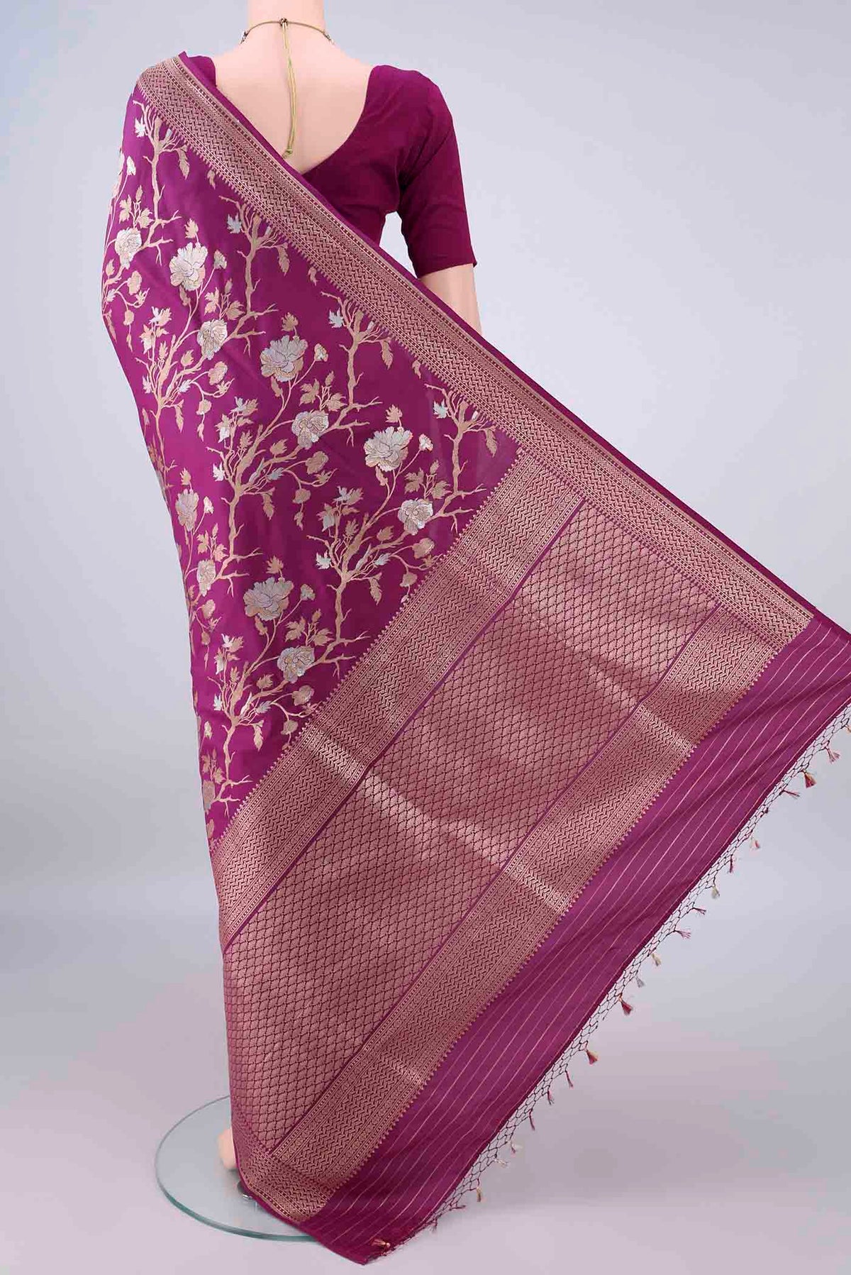 Flat view of Pure Silk Magenta Banarasi Saree with Zari Butta on the body and Zari Border. 