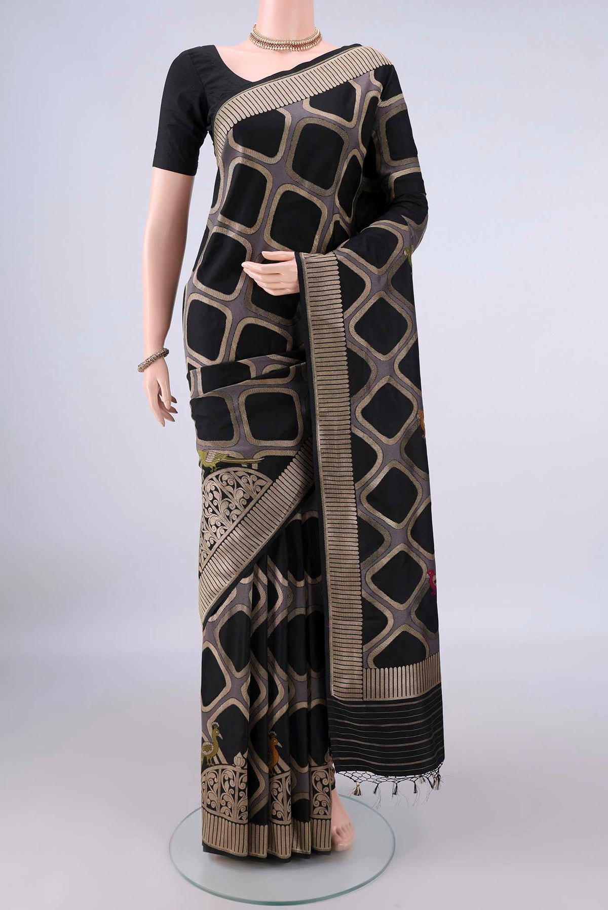 Pure Silk Black Banarasi Saree with Zari Butta on the body and Zari Border.  displayed on a mannequin