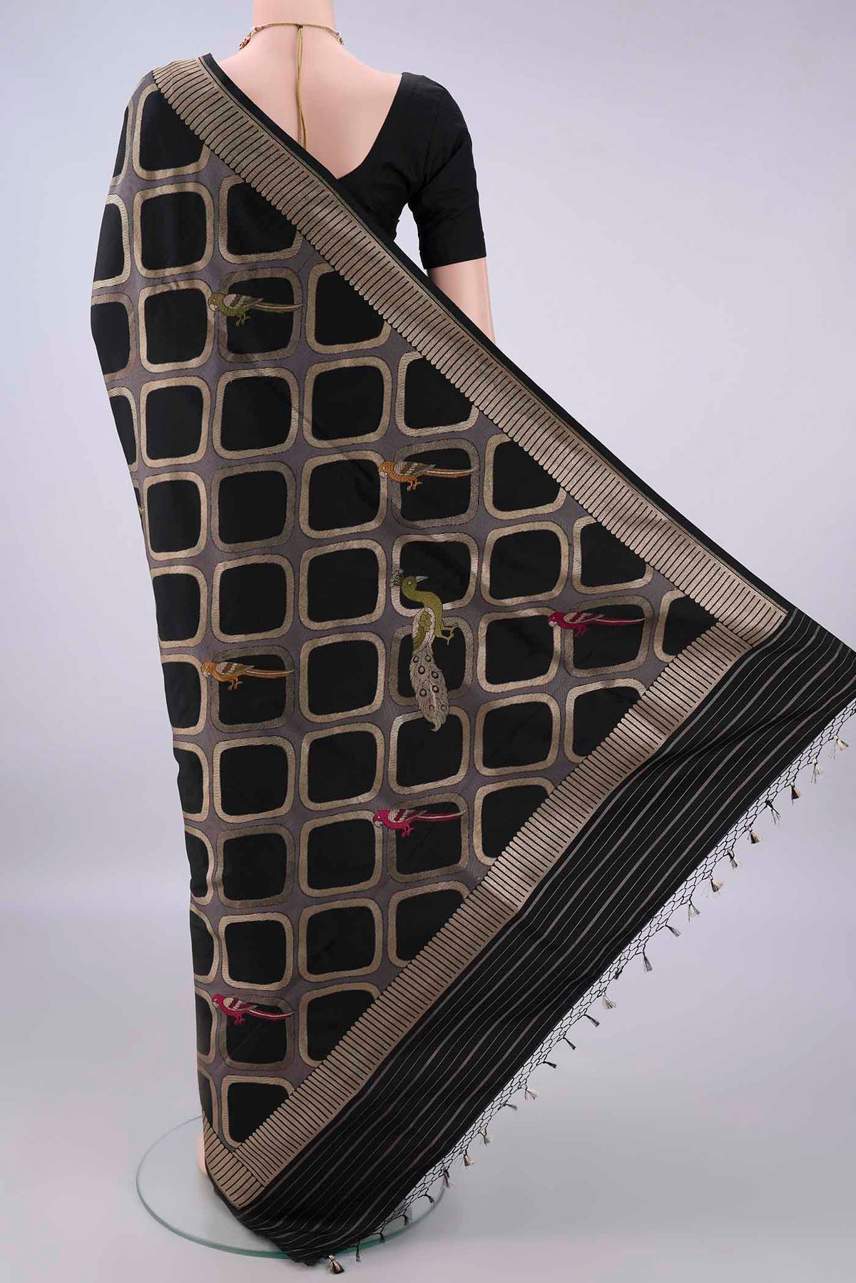 Flat view of Pure Silk Black Banarasi Saree with Zari Butta on the body and Zari Border. 