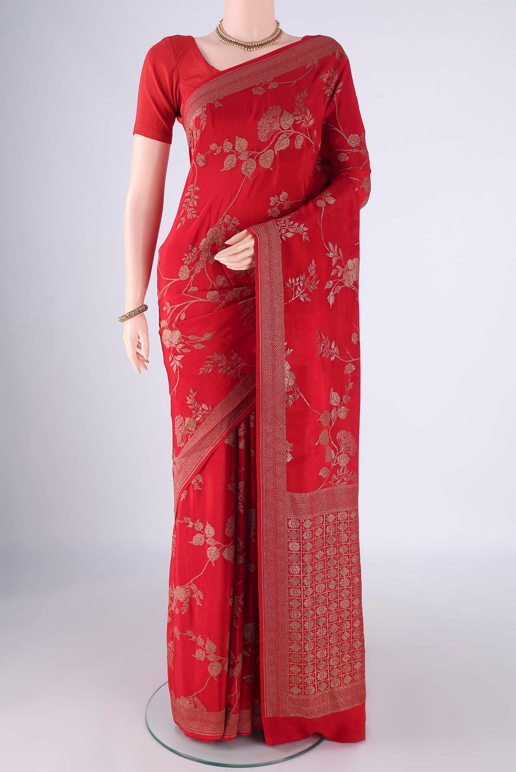Red Banarasi Georgette Saree with Zari Brocade on the body and Zari Border.  displayed on a mannequin