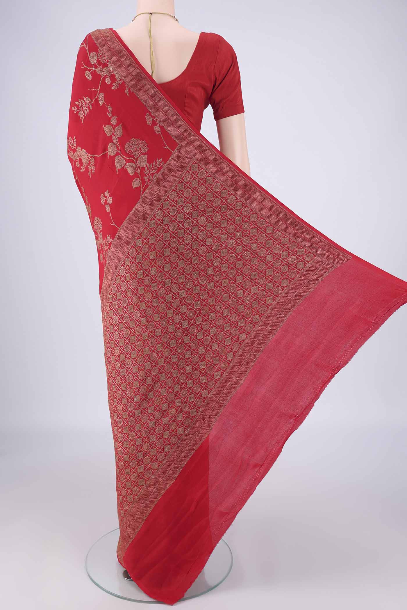 Flat view of Red Banarasi Georgette Saree with Zari Brocade on the body and Zari Border. 
