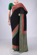 Black Banarasi Georgette Saree with Zari Butta on the body and Zari Border.  displayed on a mannequin