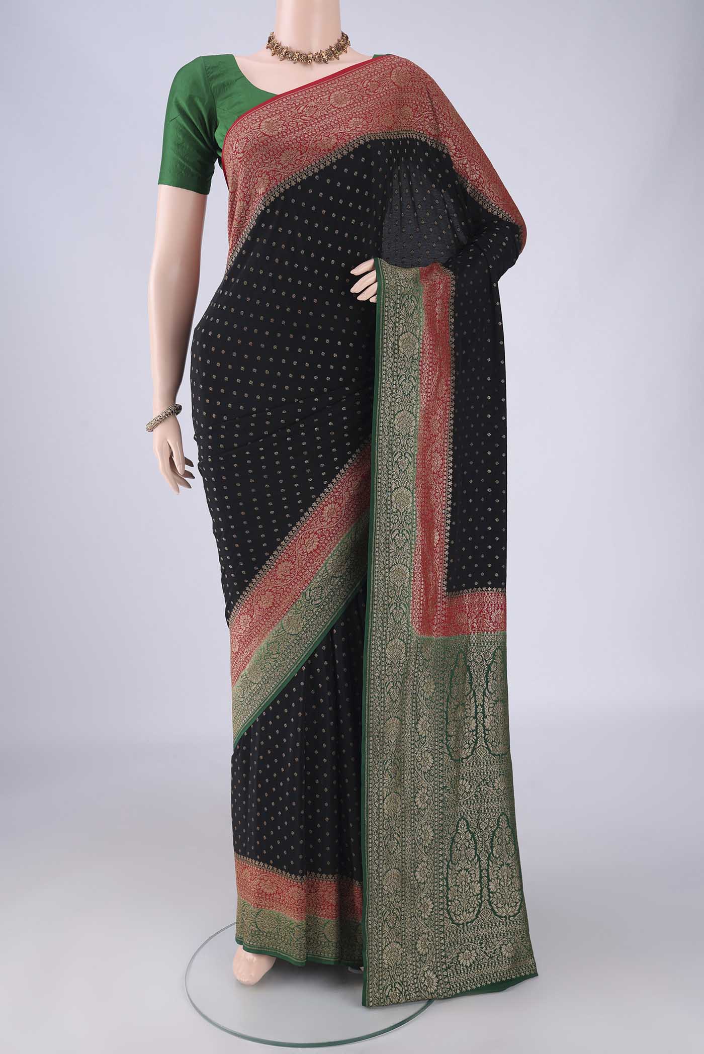 Black Banarasi Georgette Saree with Zari Butta on the body and Zari Border.  displayed on a mannequin