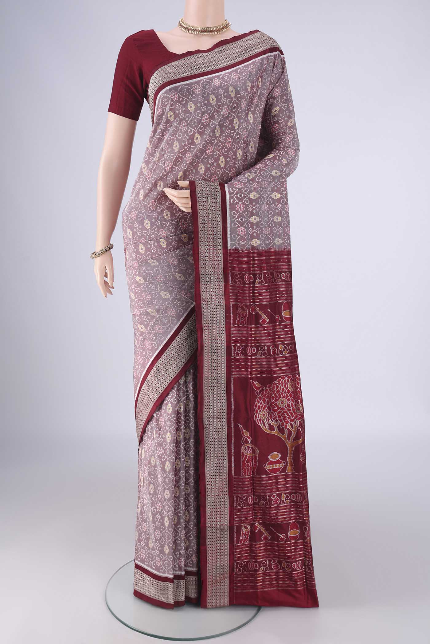 Brown Orissa Silk Saree with Pure Ikat on the body and Thread Border.  displayed on a mannequin