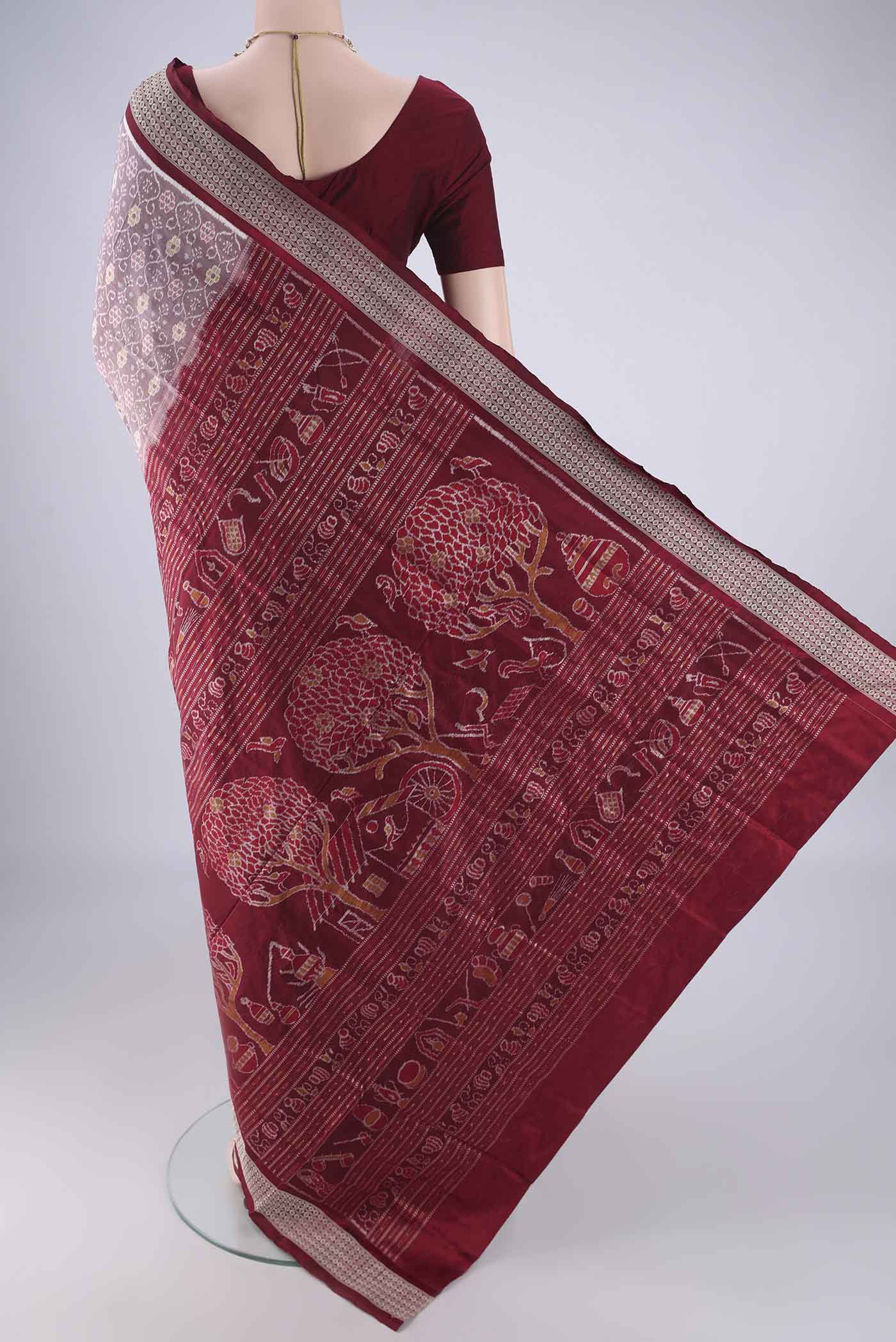 Flat view of Brown Orissa Silk Saree with Pure Ikat on the body and Thread Border. 