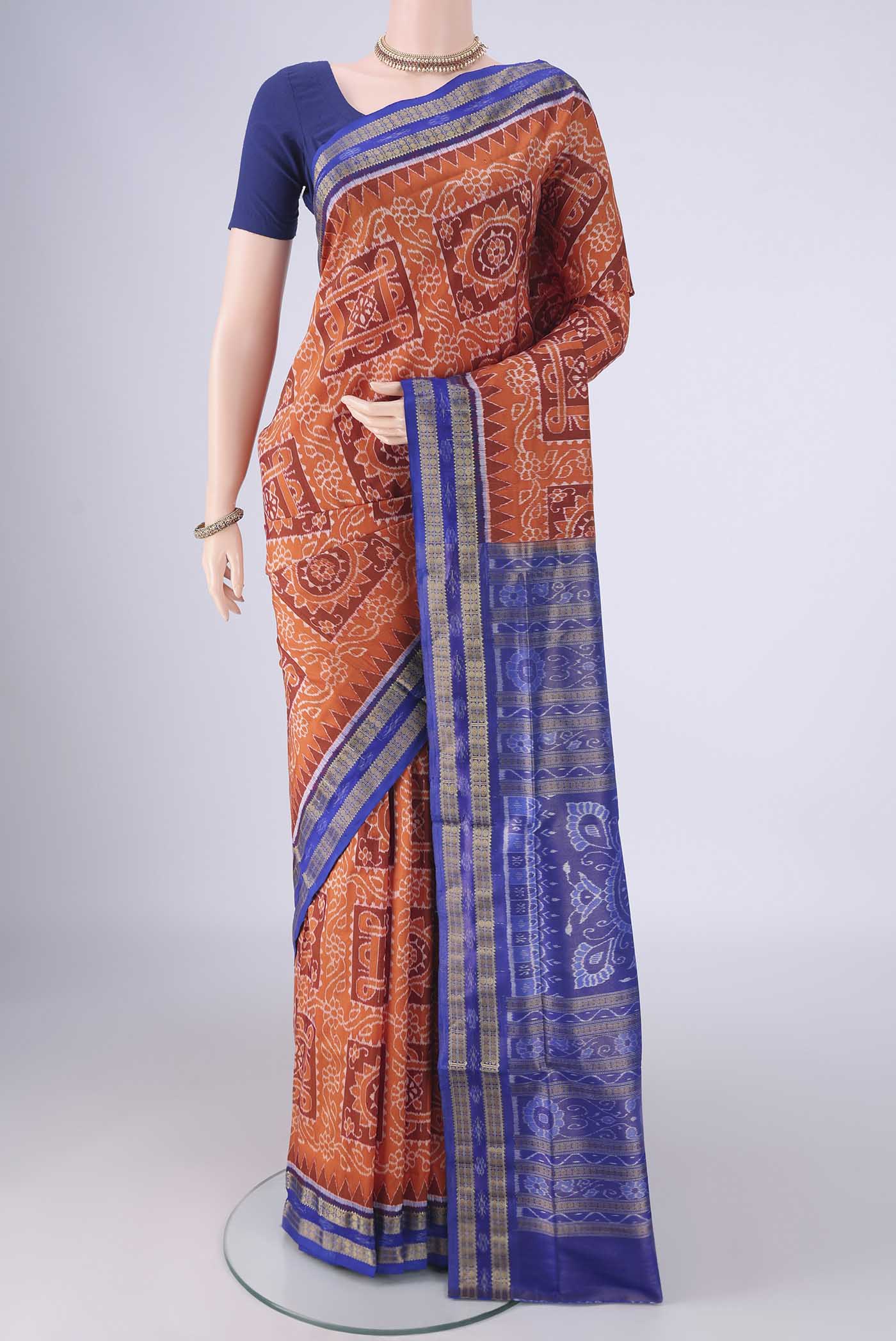 Orange Orissa Silk Saree with Pure Ikat on the body and Thread Border.  displayed on a mannequin