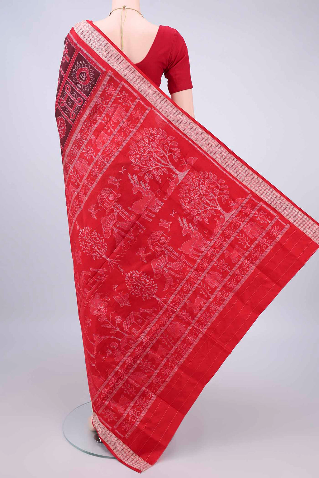 Flat view of Pure Silk Brown Orissa Ikat Saree with Ikat design on the body and Thread Border. 