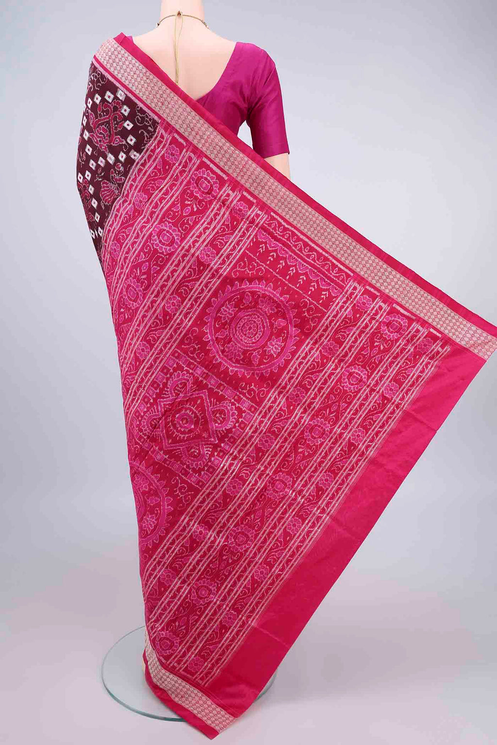 Flat view of Pure Silk Coffee Brown Orissa Ikat Saree with Ikat design on the body and Thread Border. 