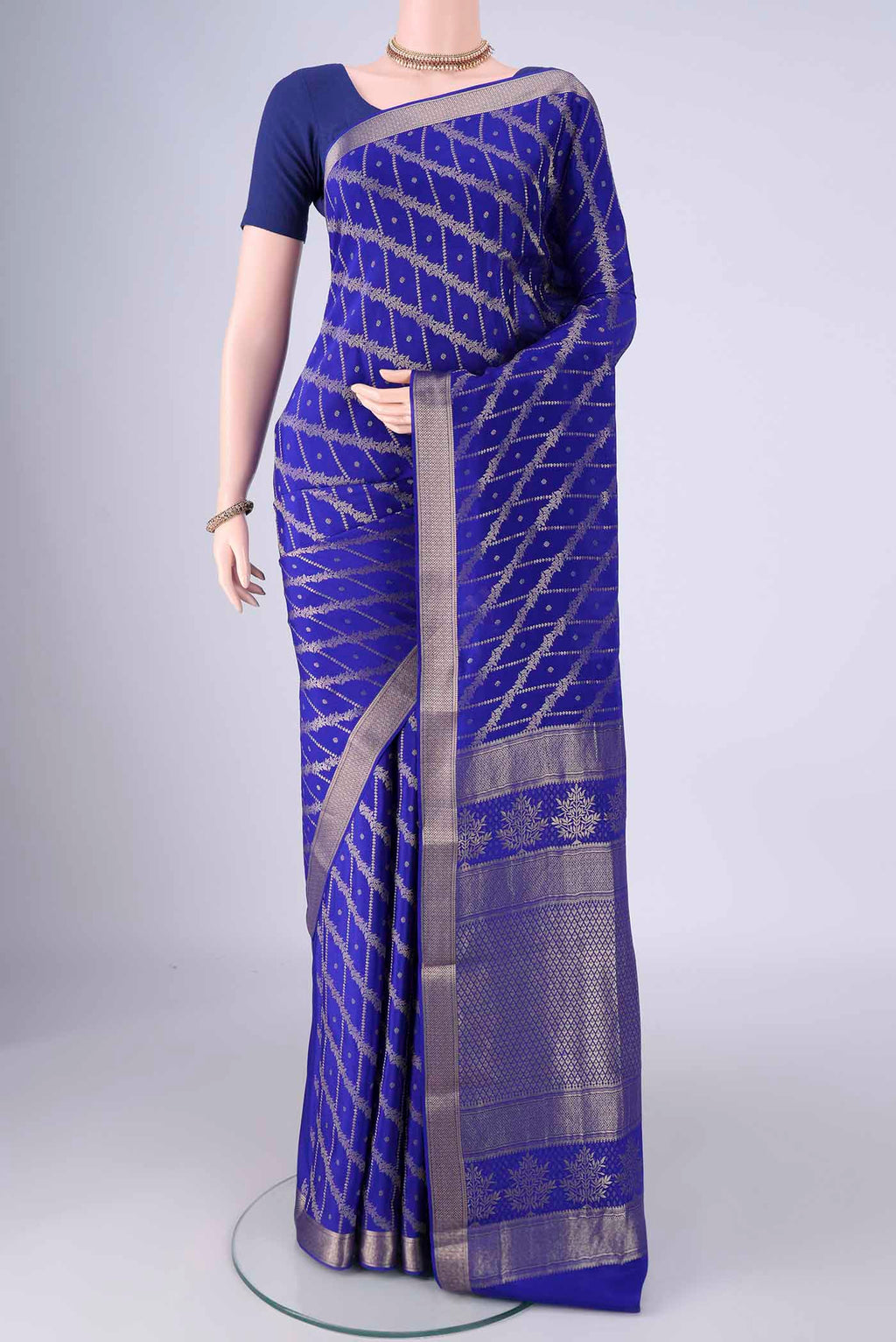 Royal Blue Mysore Crepe Saree with Zari Brocade on the body and Zari Border.  displayed on a mannequin