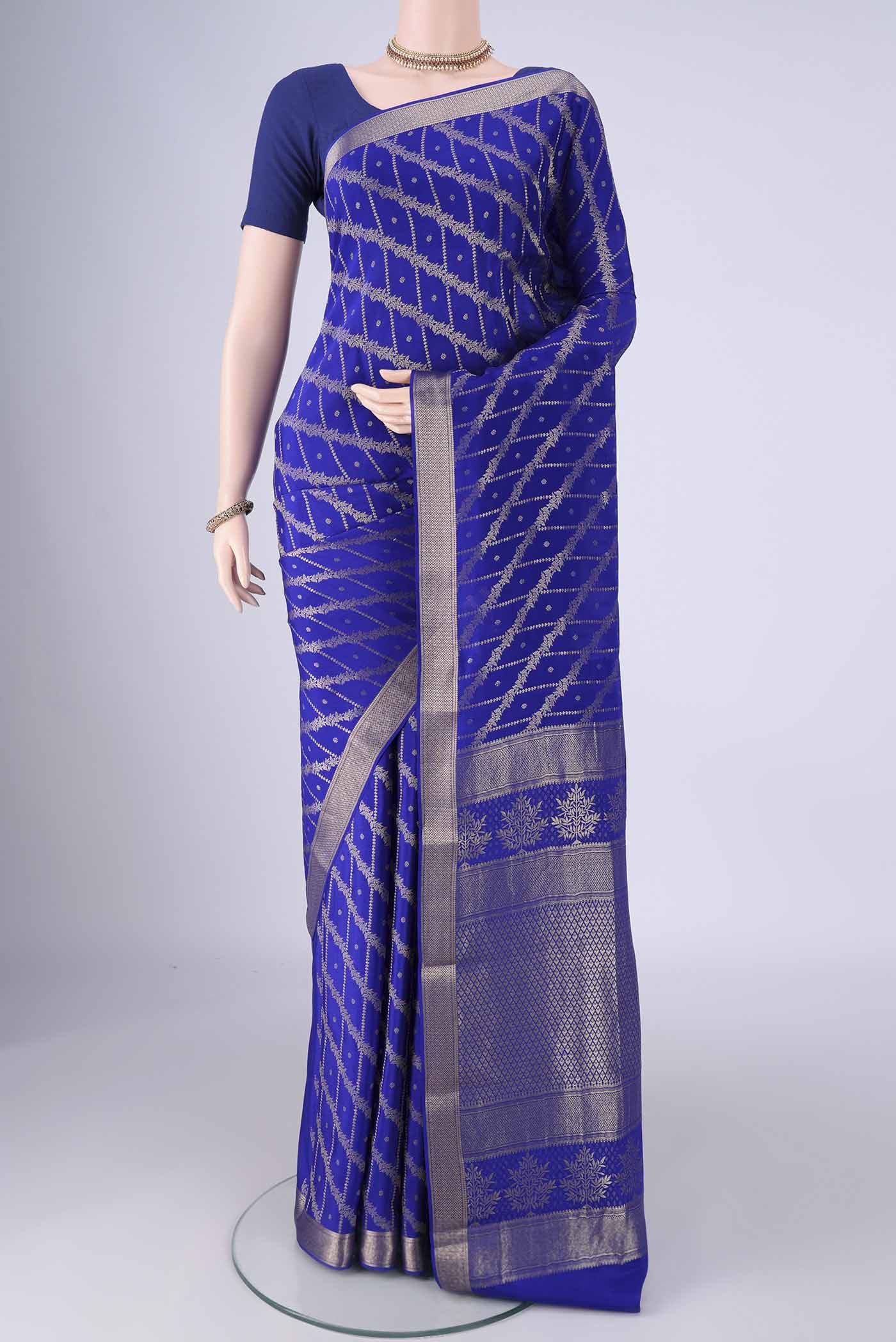 Royal Blue Mysore Crepe Saree with Zari Brocade on the body and Zari Border.  displayed on a mannequin