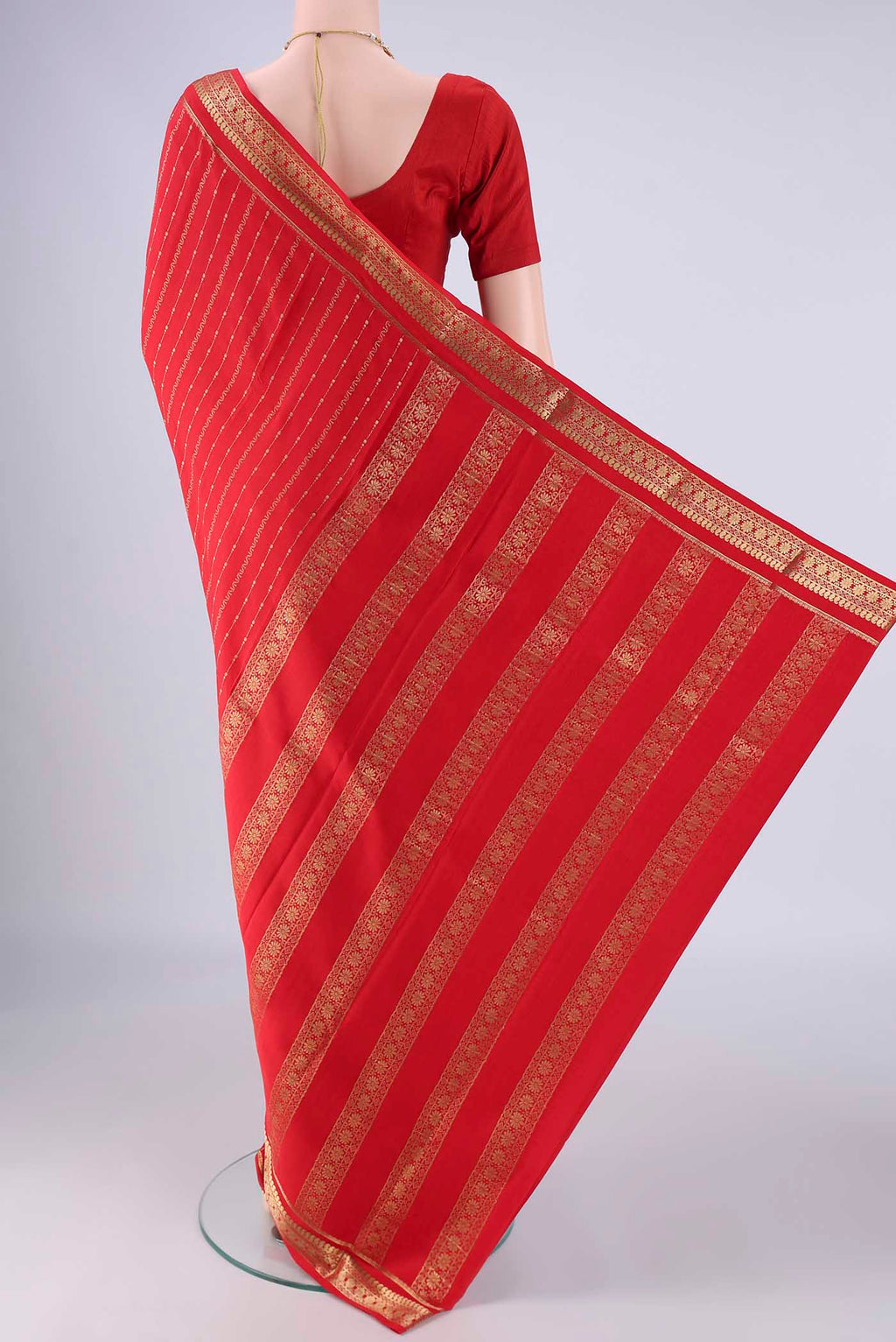 Flat view of Red Mysore Crepe Saree with Stripes on the body and Zari Border. 