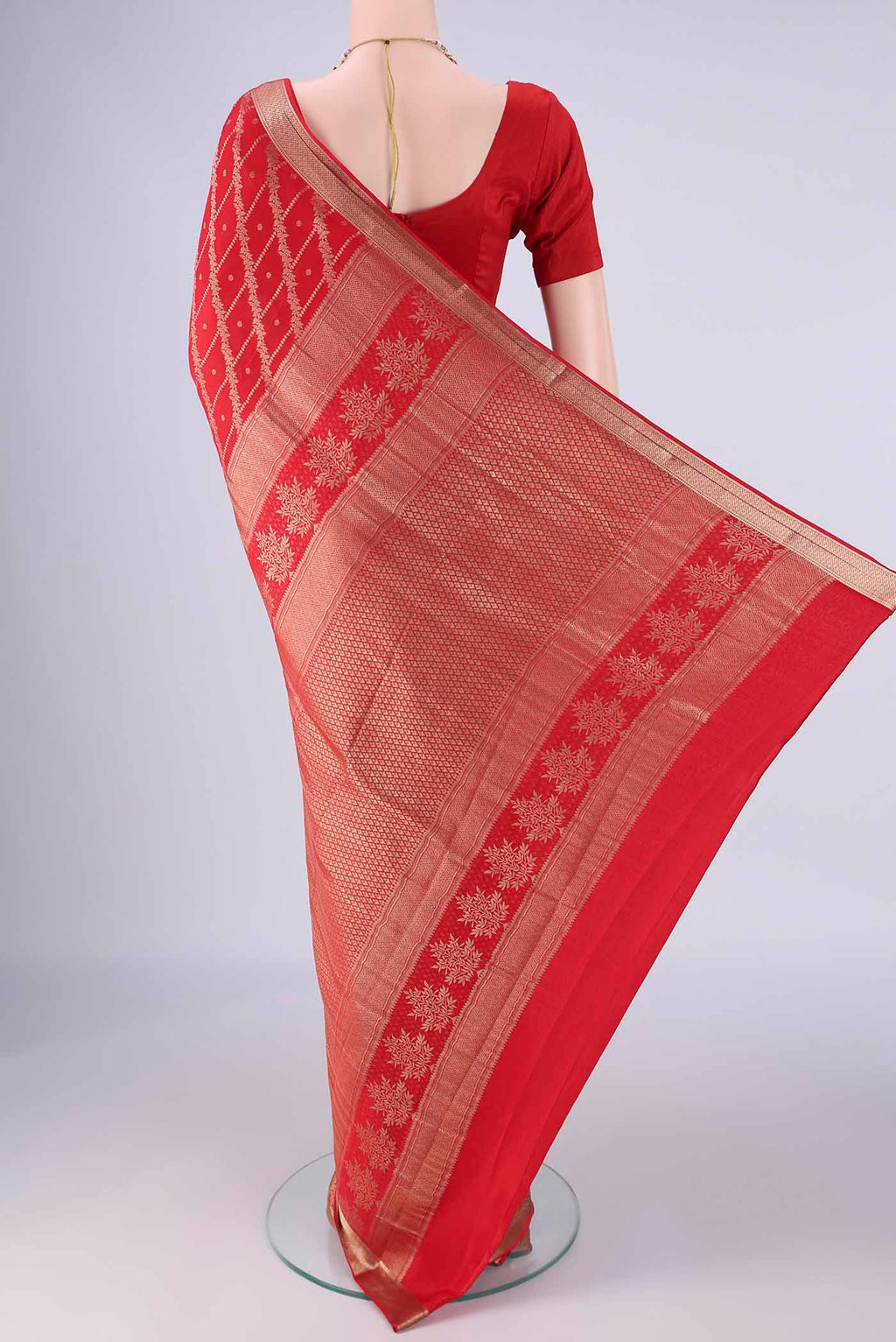 Flat view of Red Mysore Crepe Saree with Zari Brocade on the body and Zari Border. 