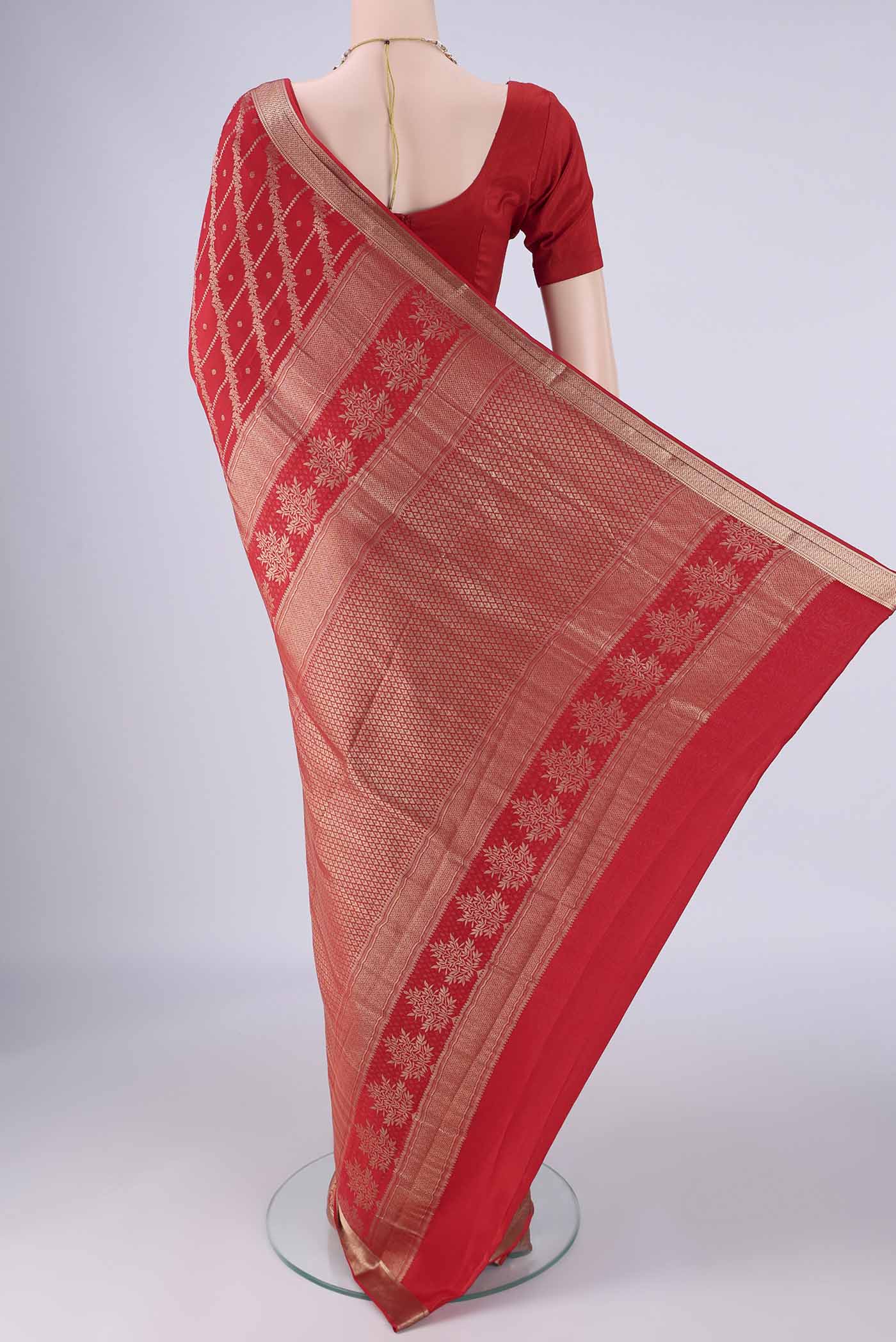 Flat view of Red Mysore Crepe Saree with Zari Brocade on the body and Zari Border. 