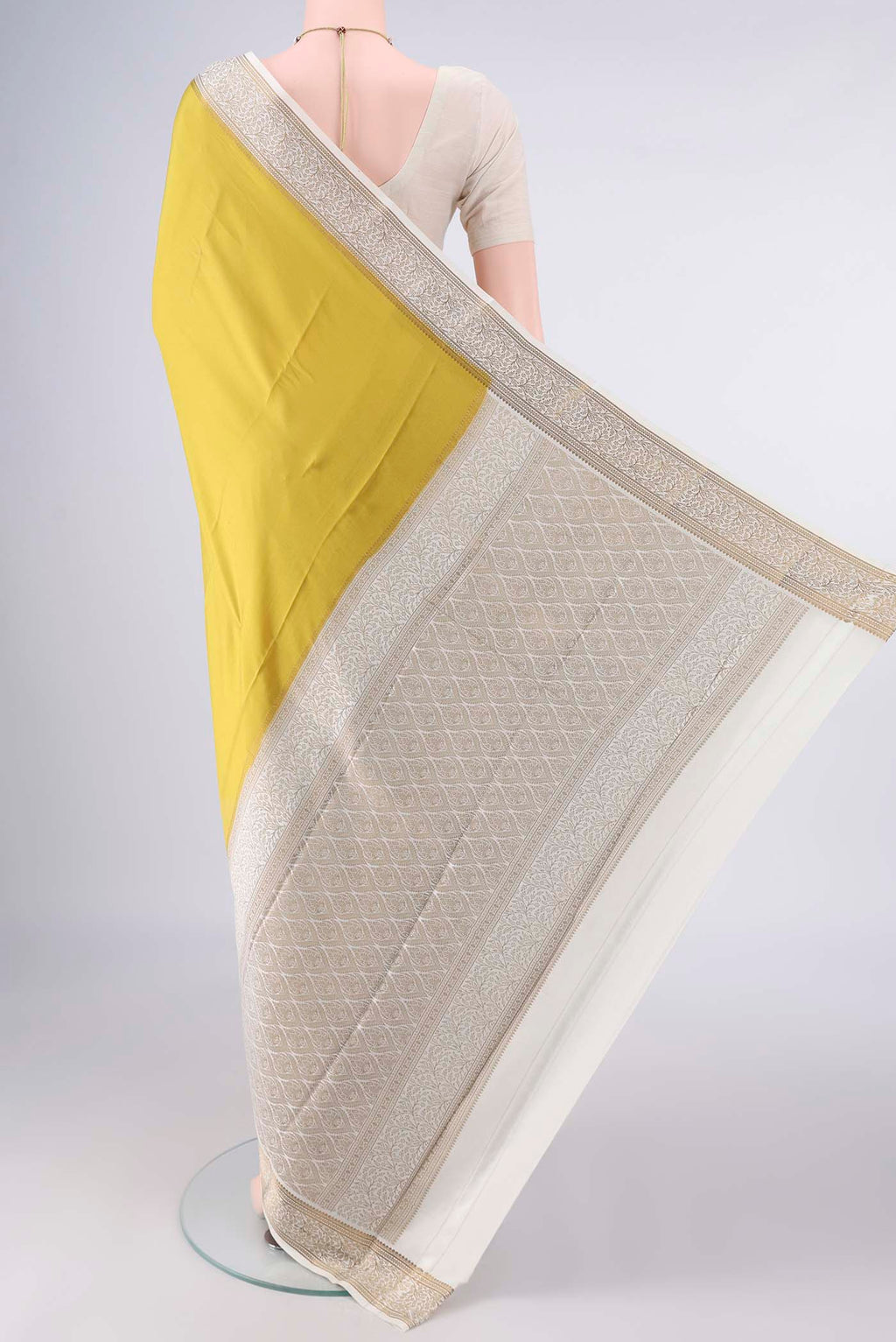 Flat view of Mustard Mysore Crepe Saree with Plain Body and Zari Border. 