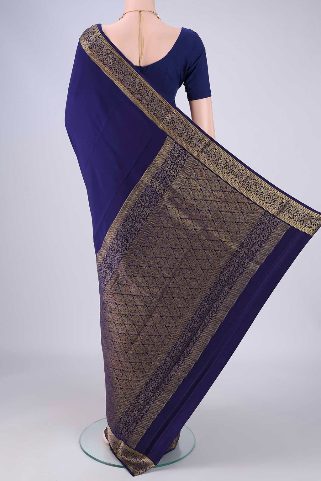 Flat view of Navy Blue Mysore Crepe Saree with Plain Body and Zari Border. 