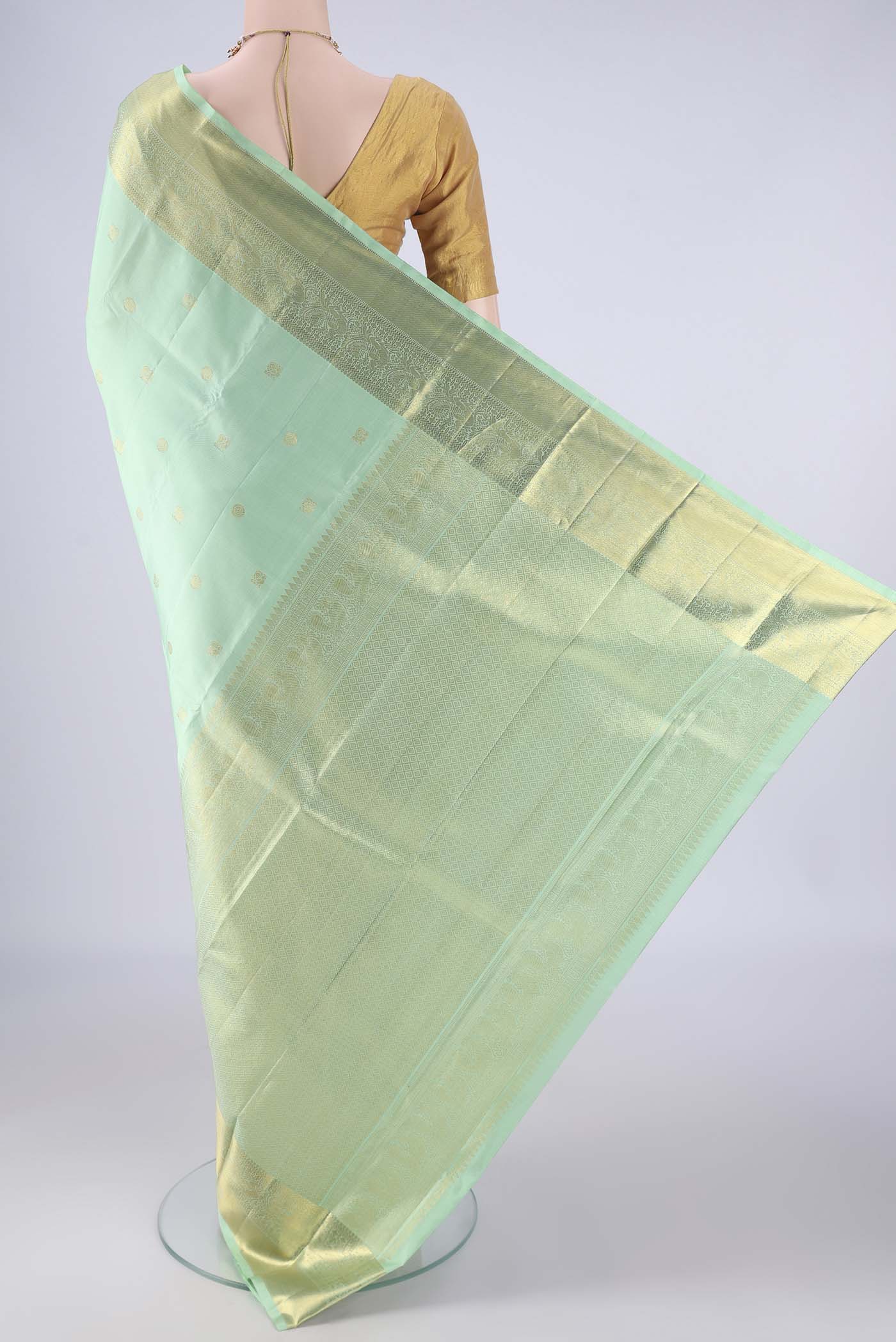 Flat view of Sea Green Kanchipuram Silk Saree with Zari Butta on the body and Zari Border. 