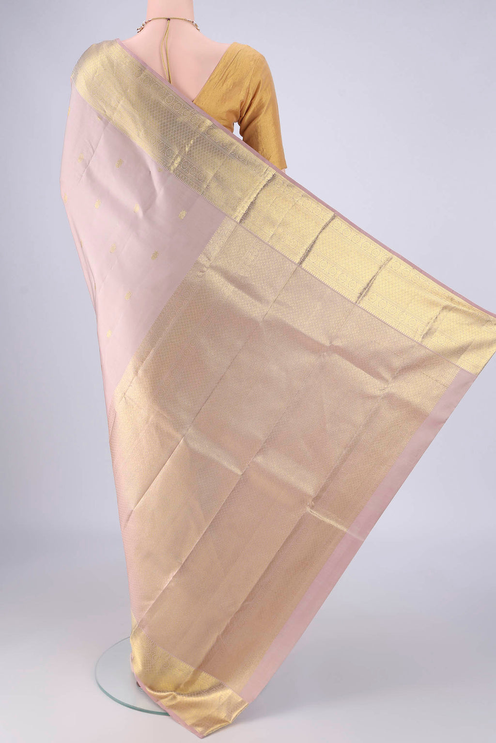 Flat view of Lavender Kanchipuram Silk Saree with Zari Butta on the body and Zari Border. 