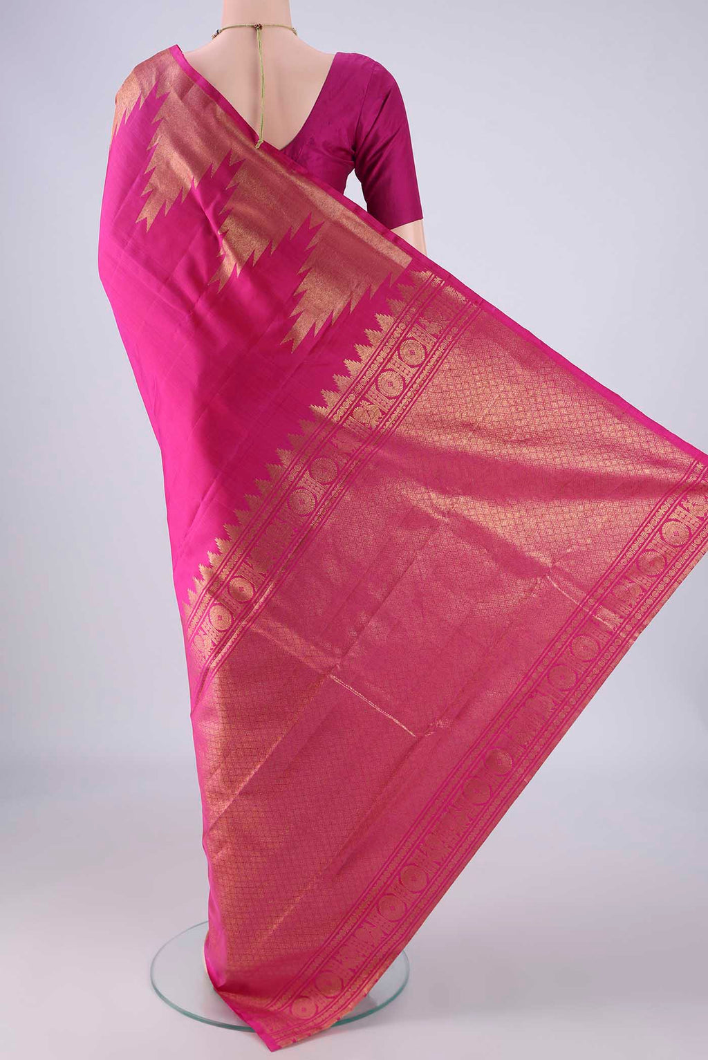 Flat view of Rani Pink Kanchipuram Silk Saree with Plain Body and Temple Border. 