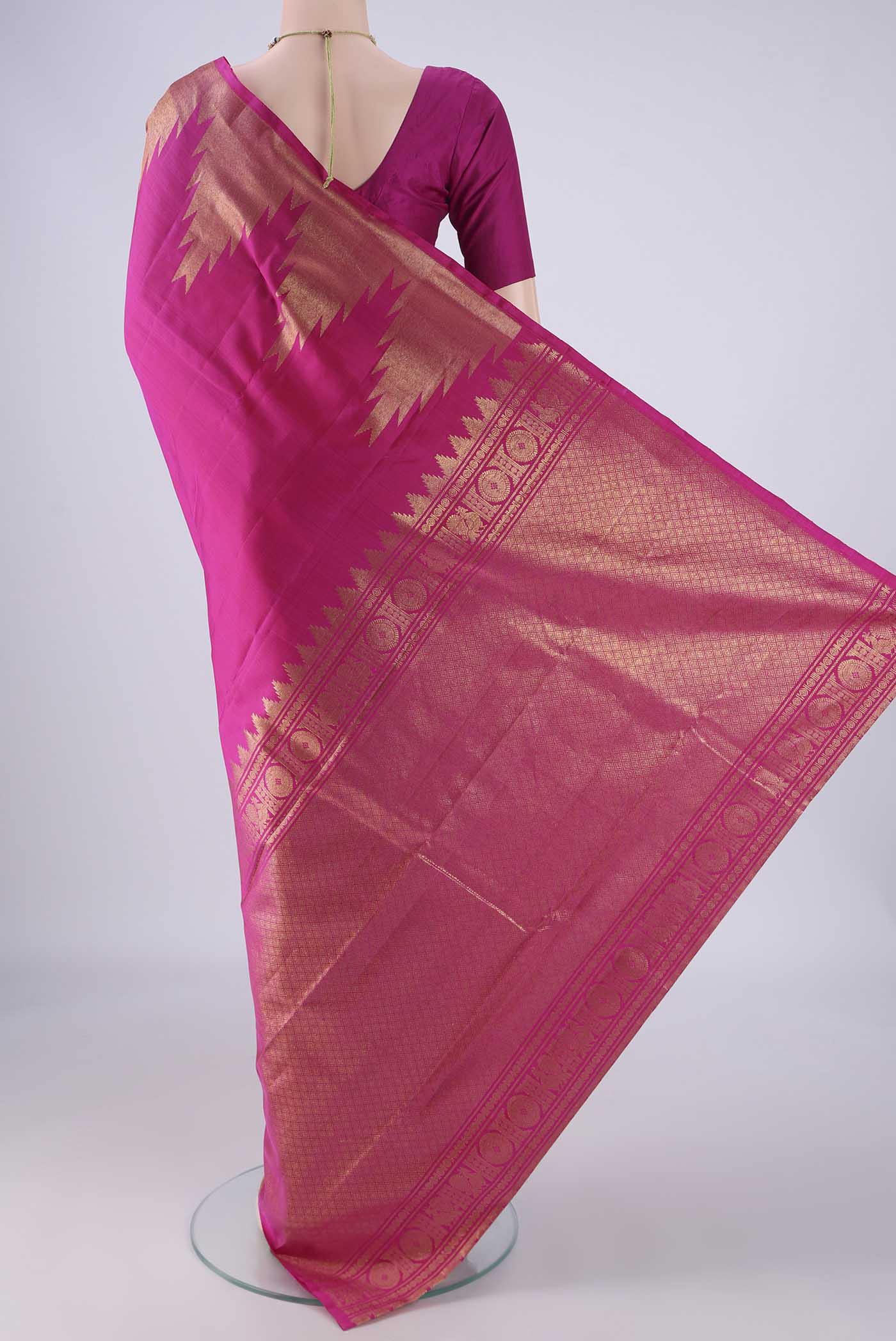 Flat view of Rani Pink Kanchipuram Silk Saree with Plain Body and Temple Border. 