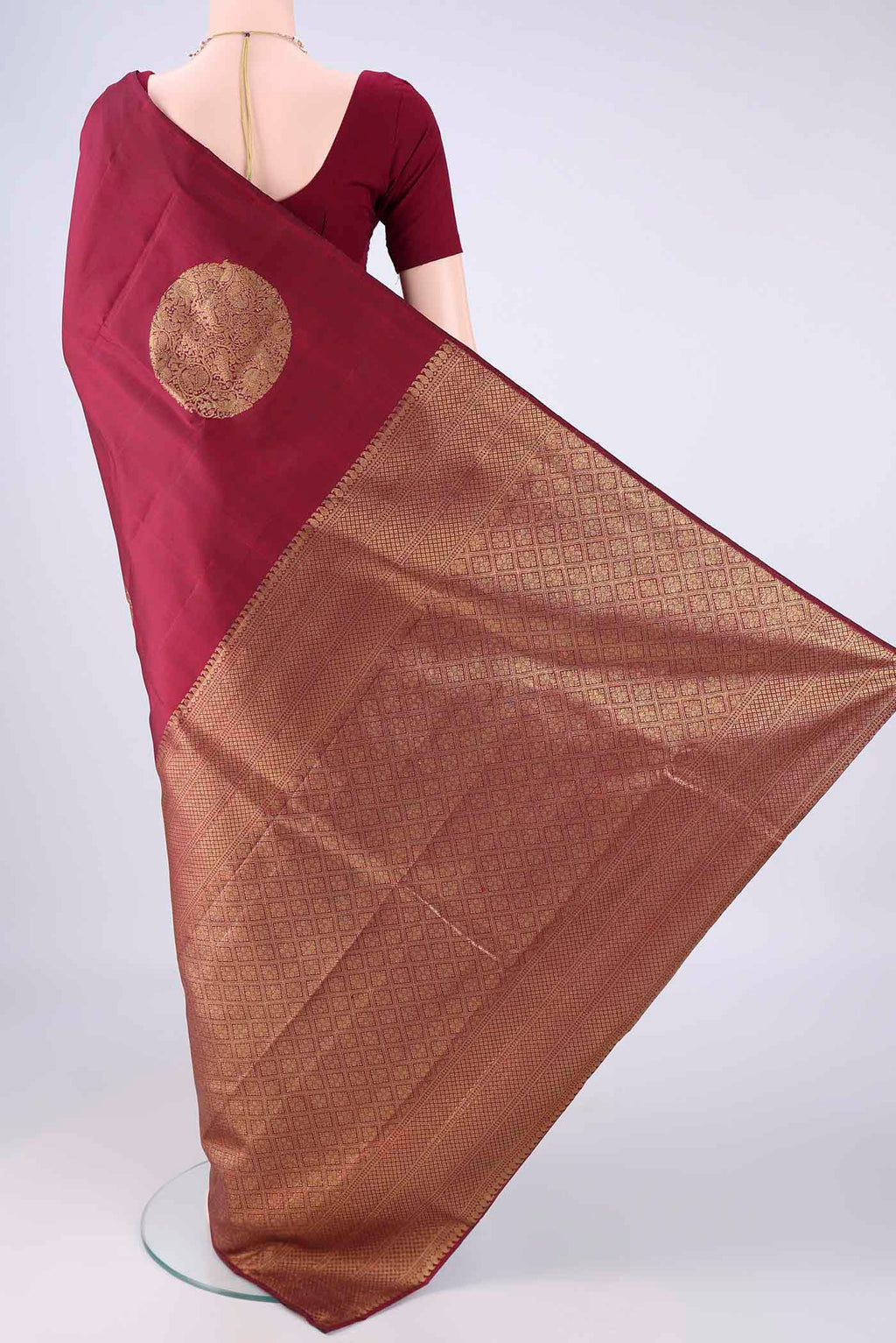 Flat view of Maroon Kanchipuram Silk Saree with Zari Butta on the body and Without Border. 
