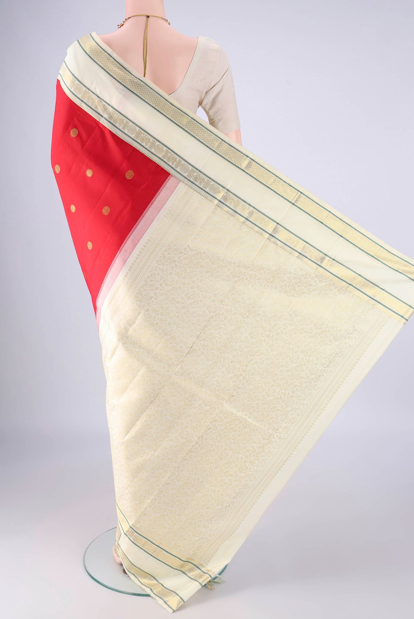 Flat view of Red Kanjivaram Silk Saree with Zari Butta on the body and Zari Border. 