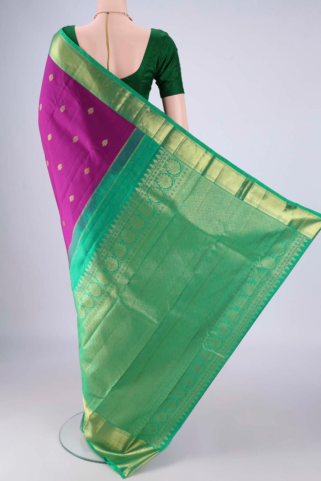 Flat view of Purple Kanjivaram Silk Saree with Zari Butta on the body and Zari Border. 