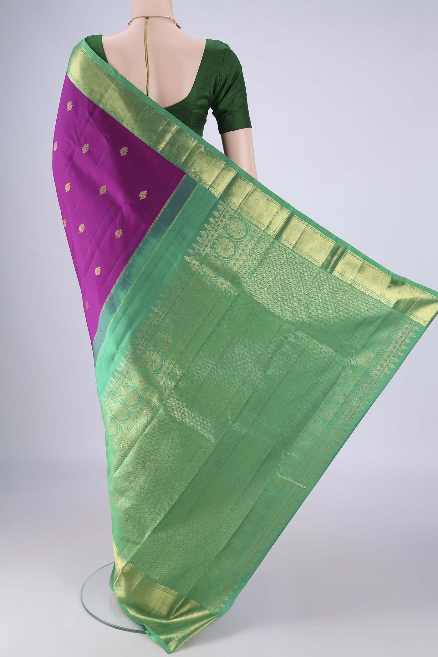Flat view of Purple Kanjivaram Silk Saree with Zari Butta on the body and Zari Border. 