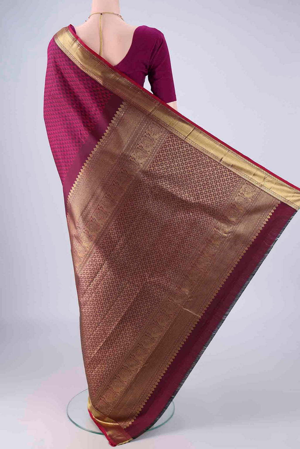 Flat view of Magenta Kanjivaram Silk Saree with Jacquard design on the body and Zari Border. 