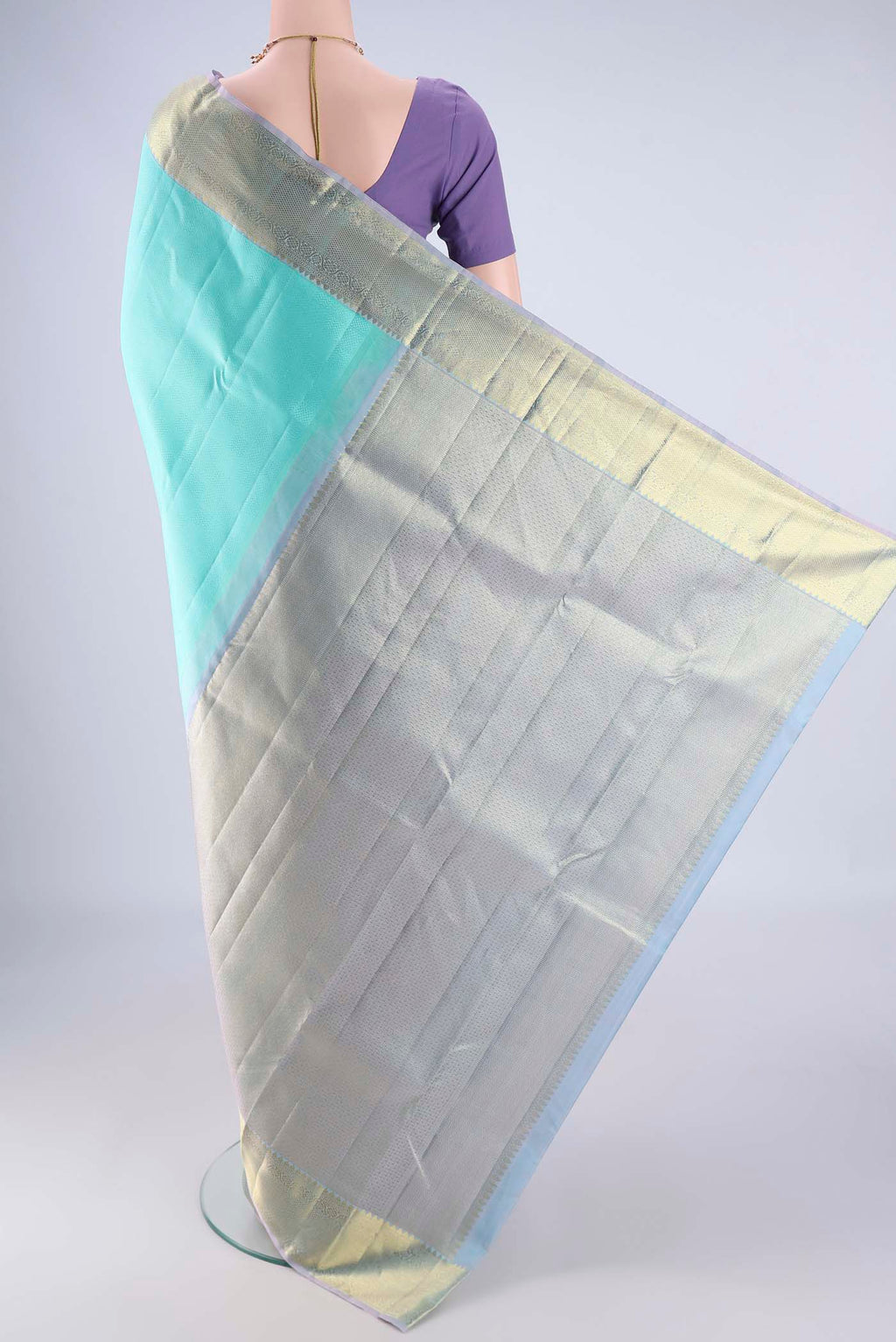 Flat view of Turquoise Kanjivaram Silk Saree with Jacquard design on the body and Zari Border. 