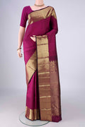 Magenta Kanjivaram Silk Saree with Jacquard design on the body and Zari Border.  displayed on a mannequin