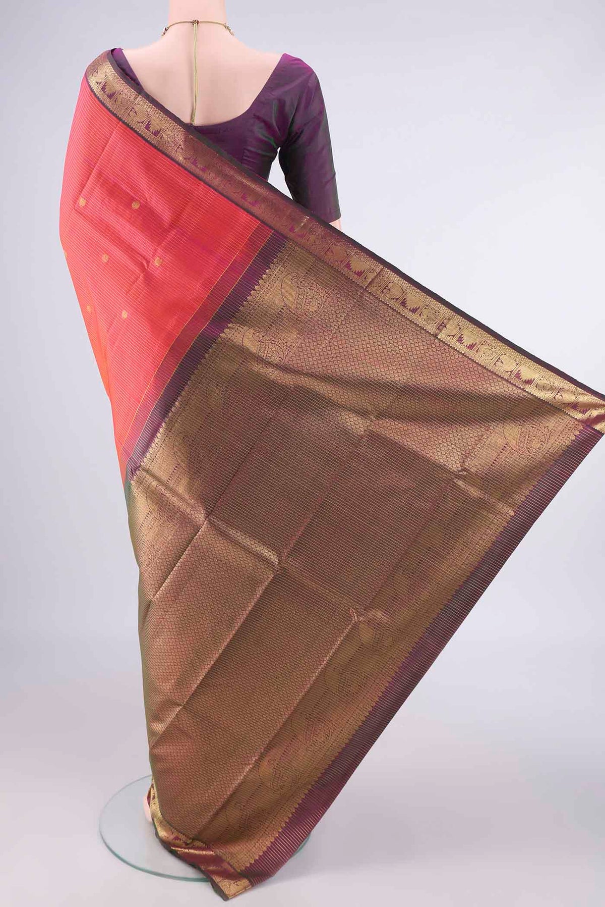 Flat view of Pure Silk Orange Kanchipuram Saree with Stripes on the body and Zari Border. 