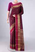 Maroon Kanjivaram Silk Saree with Checked design on the body and Zari And Thread Border.  displayed on a mannequin