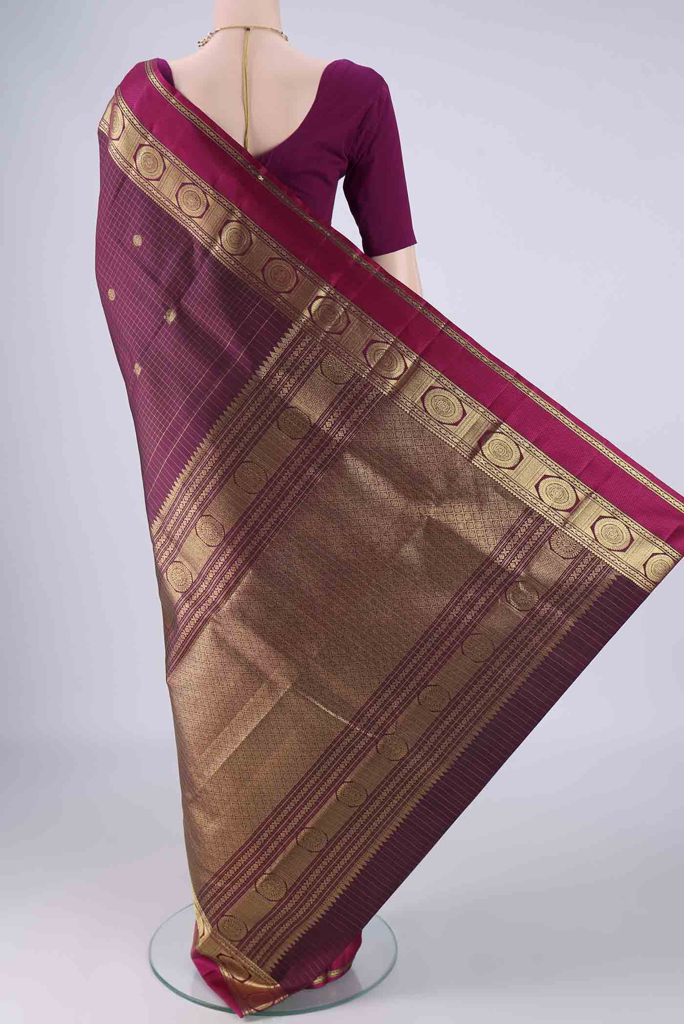 Flat view of Maroon Kanjivaram Silk Saree with Checked design on the body and Zari And Thread Border. 